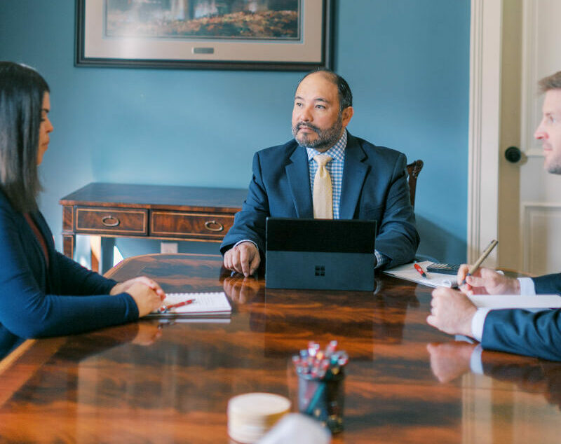 The Good Wealth team sitting around a table